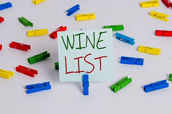 Text sign showing Wine List. Conceptual photo menu of wine selections for purchase typically in a restaurant Colored clothespin papers empty reminder white floor background office.