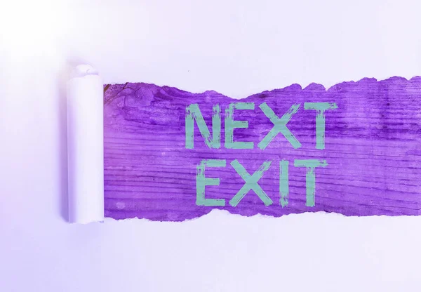 Rukopis Next Exit. Koncept znamená následující cestu ven nebo akt odchodu na místě nebo dálnici. — Stock fotografie