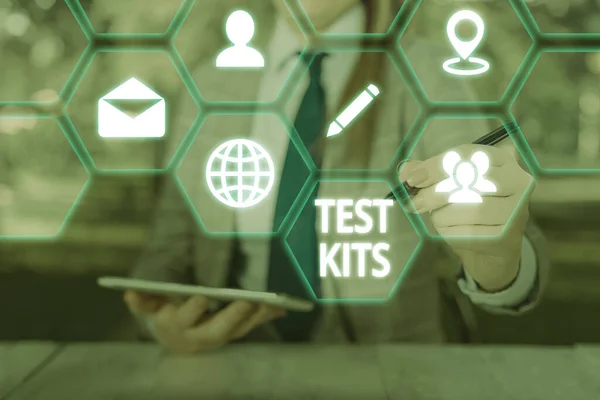 Conceptual hand writing showing Test Kits. Business photo showcasing tools used to detect the presence of something in the body.