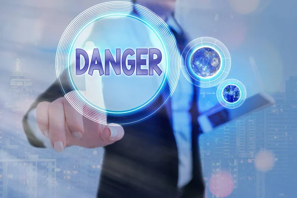 Writing note showing Danger. Business photo showcasing the possibility of something unwelcome or unpleasant happening Elements of this image furnished by NASA. — Stock Photo, Image