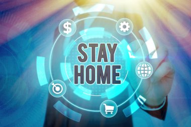 Stay Home 'u gösteren bir not yazıyorum. İş fotoğrafı gösterimi bir etkinlik için dışarı çıkmayın ve evde ya da evde kalın..