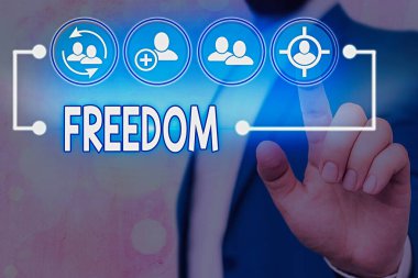 Özgürlük 'ü gösteren mesaj işareti. Hapsedilmekten ya da fiziksel baskı altında olmaktan ziyade kavramsal fotoğraf özgürlüğü.