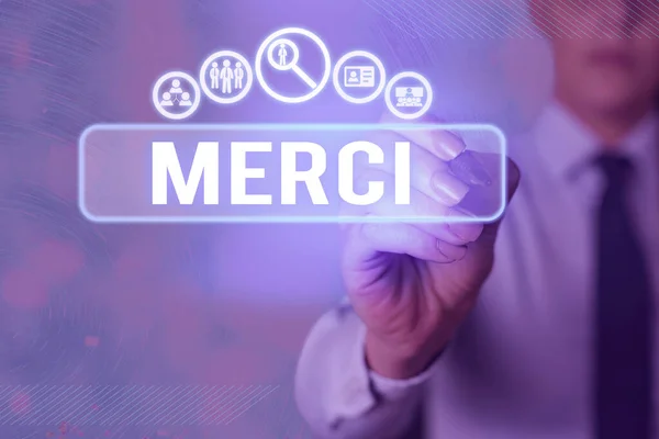Writing note showing Merci. Business photo showcasing what is said or response when someone helps you in France Thank you. — Stok fotoğraf