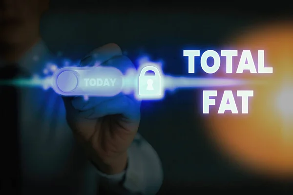 Почерк написания текста Total Fat. Понятие, означающее совокупную стоимость различных видов жиров, показанных на этикетке . — стоковое фото