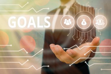 Hedefleri gösteren kavramsal el yazısı. İş fotoğrafı metinleri hırs veya çaba göstererek istenen sonucu elde etmeyi amaçlıyor..