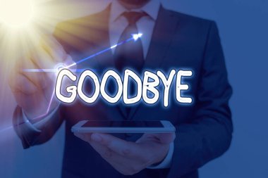 Elveda yazan kavramsal el yazısı. İş fotoğrafı metni bir konuşmanın ayrılması veya bitmesinde iyi dilekleri ifade etmek için kullanılır.