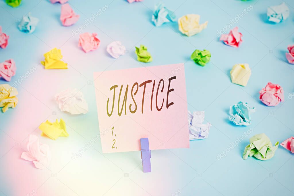 Writing note showing Justice. Business photo showcasing Quality of being just impartial or fair Administration of law rules Colored crumpled papers empty reminder blue floor background clothespin.