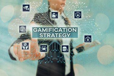 Gamification Strategy 'yi gösteren bir not yazıyorum. Motivasyon Entegre Oyun Mekanikleri için iş fotoğrafı gösterimi kullanım ödülleri.