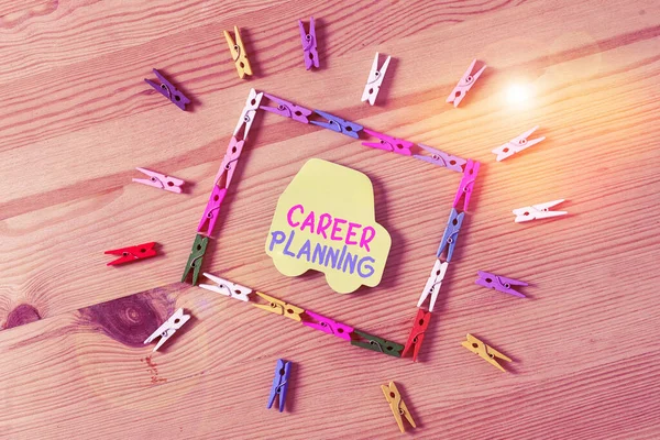 Text sign showing Career Planning. Conceptual photo individuals long process of setting up demonstrating career Colored clothespin papers empty reminder wooden floor background office.