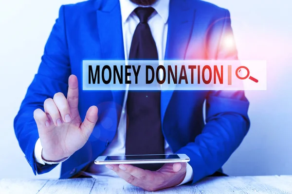 Text sign showing Money Donation. Conceptual photo something which someone gives to a charity or other Businessman with pointing finger in front of him.