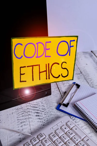 Word writing text Code Of Ethics. Business concept for basic guide for professional conduct and imposes duties Note paper taped to black computer screen near keyboard and stationary. — Stock Photo, Image