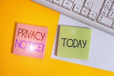 Handwriting text writing Privacy Notice. Concept meaning fulfils a legal requirement to protect a customer or client Paper with copy space and keyboard above orange background table.