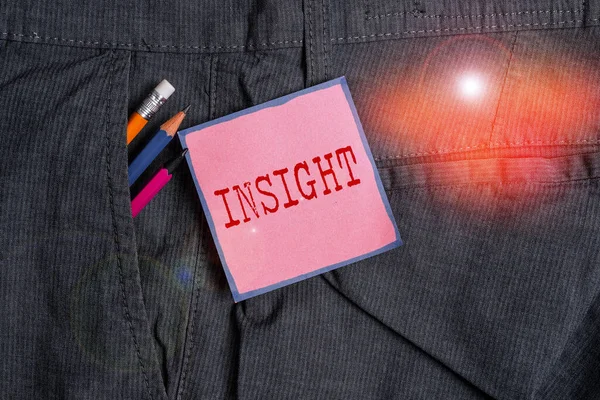 Handwriting text writing Insight. Concept meaning Capacity Gain accurate deep understanding of someone or something Writing equipment and pink note paper inside pocket of man work trousers. — Stockfoto