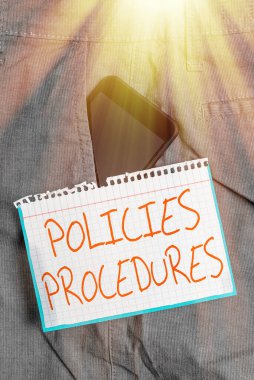 Writing note showing Policies Procedures. Business photo showcasing Influence Major Decisions and Actions Rules Guidelines Smartphone device inside trousers front pocket note paper. clipart