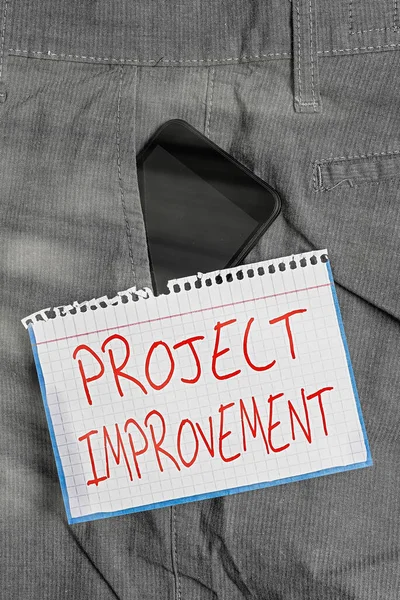 Schreiben Notiz zeigt Project Improvement. Business-Foto zeigt Methoden Techniken, um ein definiertes Ziel Smartphone-Gerät in der Hosentasche Notizpapier zu erreichen. — Stockfoto