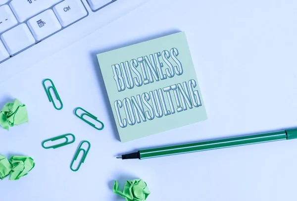 Text sign showing Business Consulting. Conceptual photo Blends Practice of Academic Theoretical Expertise Square empty green note paper with pencil on the white background and pc keyboard.