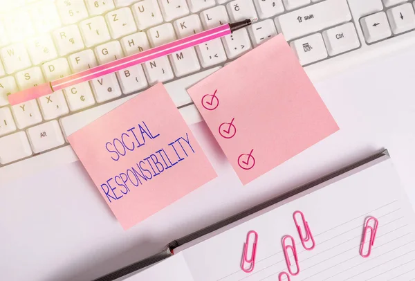 Handwriting text Social Responsibility. Concept meaning Obligation for the Benefit of Society Balance in life Flat lay above blank copy space sticky notes with business concept.