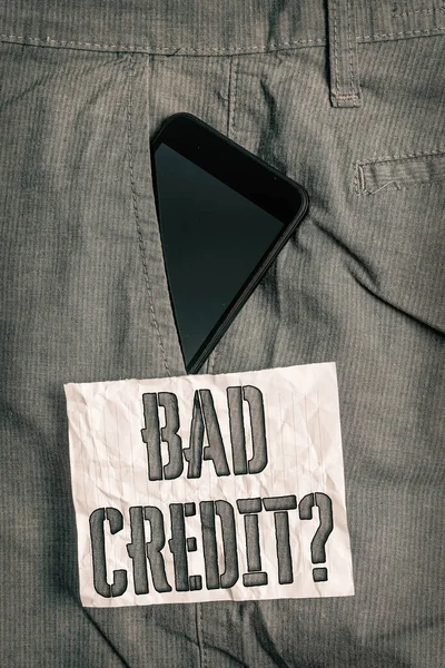 Text sign showing Bad Credit Question. Conceptual photo history when it indicates that borrower has high risk Smartphone device inside formal work trousers front pocket near note paper. — Stock Photo, Image