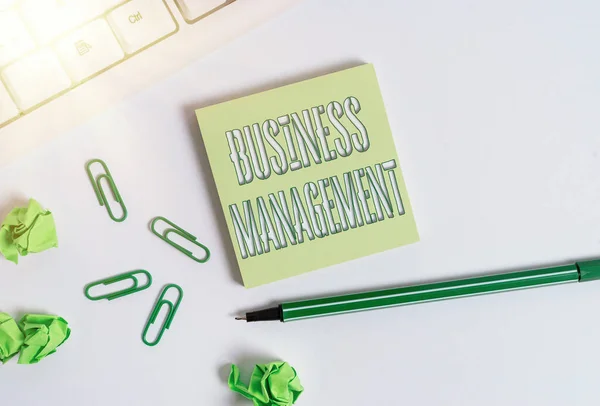 Text sign showing Business Management. Conceptual photo Overseeing Supervising Coordinating Business Operations Square empty green note paper with pencil on the white background and pc keyboard.