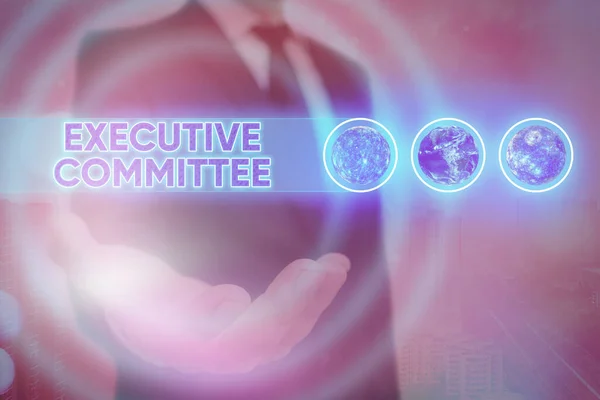 Word writing text Executive Committee. Business concept for Group of Directors appointed Has Authority in Decisions Elements of this image furnished by NASA.