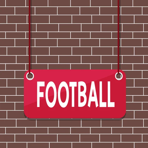 サッカーを示すテキスト記号。ボールを蹴ることを含むチームゲームの様々な形態の概念的な写真ボードの色の背景板は、文字列パネルの長方形の空の表面を添付. — ストック写真
