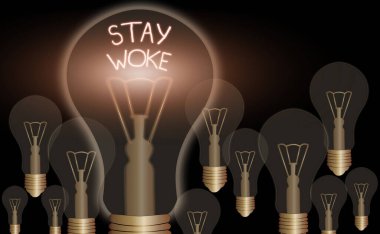 Writing note showing Stay Woke. Business photo showcasing being aware of your surroundings and things going on Keep informed.