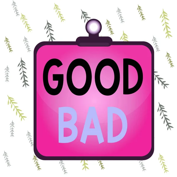 Handwriting text Good Bad. Concept meaning to seem to be going to have a good or bad result Life choices Clipboard colorful background spring clip stuck bind empty plank frame.