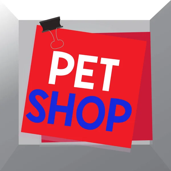 Pet Shop 'u gösteren kavramsal el yazısı. Halka farklı hayvan türleri satan iş fotoğrafçılığı işi. Kağıt yapıştırıcı, renkli arka plan hatırlatma bildirisi.. — Stok fotoğraf