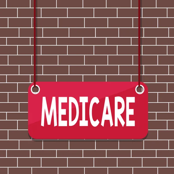Text sign showing Medicare. Conceptual photo the federal government plan in US for paying certain hospital Board color background plank attached string panel rectangle empty surface. — Stock Photo, Image