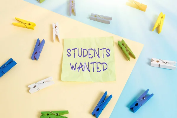 Writing note showing Students Wanted. Business photo showcasing list of things wishes or dreams young showing in school want Colored clothespin paper reminder with yellow blue background.