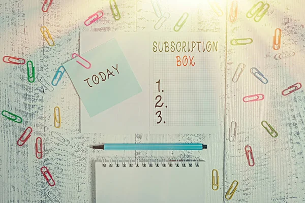 Handwriting text writing Subscription Box. Concept meaning button if you clicked on will get news or videos about site Squared spiral notepad clips note highlighter lying old wooden background. — Stock Photo, Image