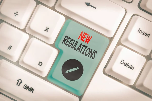 Text sign showing New Regulations. Conceptual photo Regulation controlling the activity usually used by rules.. — Stock Photo, Image