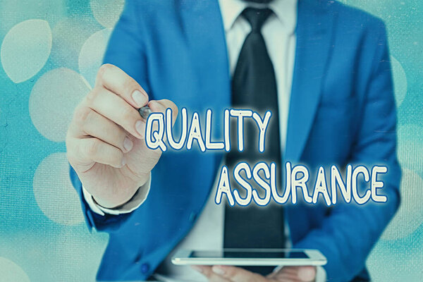 Word writing text Quality Assurance. Business concept for Ensures a certain level of quality Established requirement.