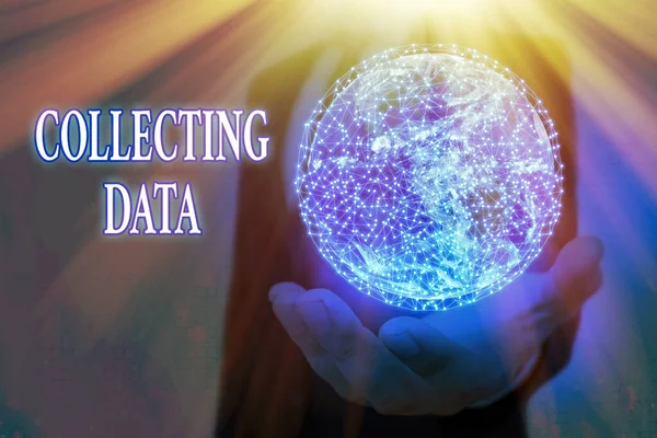 Handwriting text Collecting Data. Concept meaning Gathering and measuring information on variables of interest Elements of this image furnished by NASA.