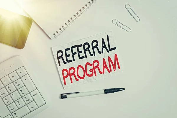 Word writing text Referral Program. Business concept for sending own patient to another physician for treatment Flat lay above computer mobile phone pencil and copy space note paper. — Stock Photo, Image