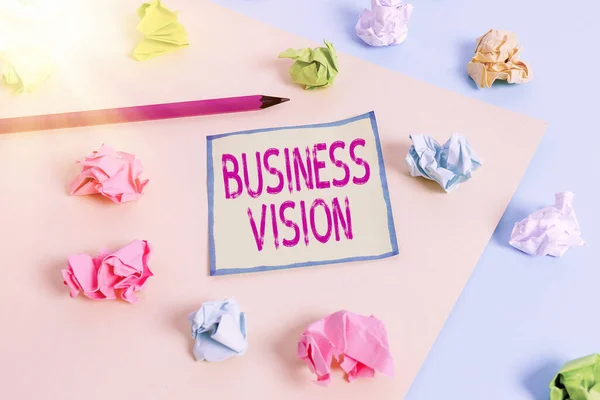 Conceptual hand writing showing Business Vision. Business photo showcasing grow your business in the future based on your goals Colored crumpled paper empty reminder blue yellow clothespin.