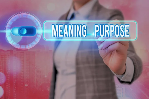 Writing note showing Meaning Purpose. Business photo showcasing The reason for which something is done or created and exists.