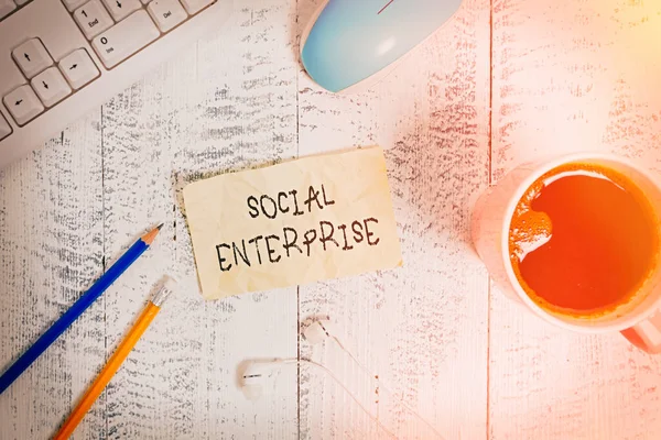Writing note showing Social Enterprise. Business photo showcasing Business that makes money in a socially responsible way Technological devices colored reminder paper office supplies. — Stock Photo, Image