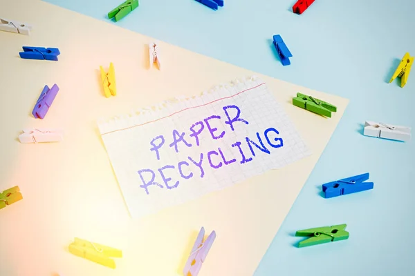 Word writing text Paper Recycling. Business concept for Using the waste papers in a new way by recycling them Colored clothespin paper empty reminder yellow blue floor background office. — Stock Photo, Image