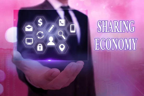 Text sign showing Sharing Economy. Conceptual photo economic model based on providing access to goods .