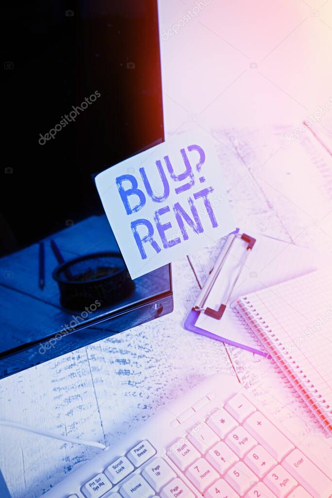 Word writing text Buy Question Rent. Business concept for Group that gives information about renting houses Note paper taped to black computer screen near keyboard and stationary.