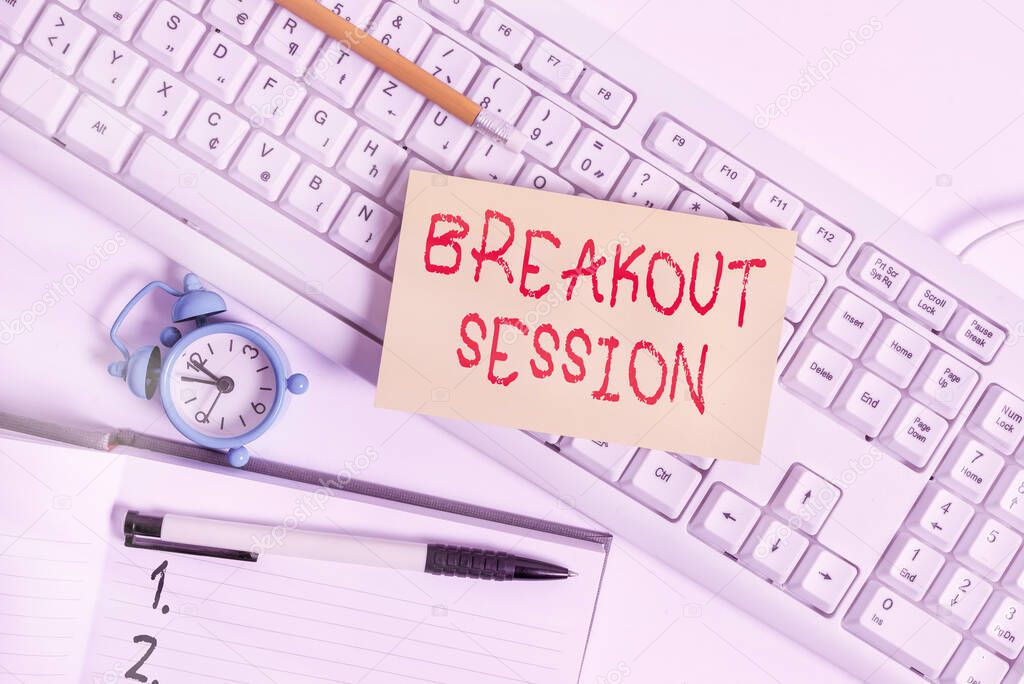 Text sign showing Breakout Session. Conceptual photo workshop discussion or presentation on specific topic Flat lay above empty note paper on the pc keyboard pencils and clock.