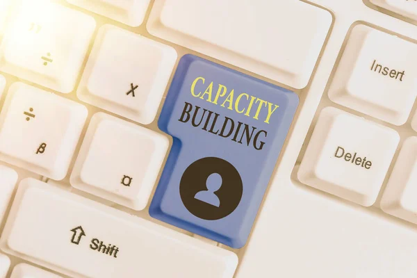 Conceptual hand writing showing Capacity Building. Business photo text Strengthen the abilities of individuals Workforce planning. — Stock Photo, Image
