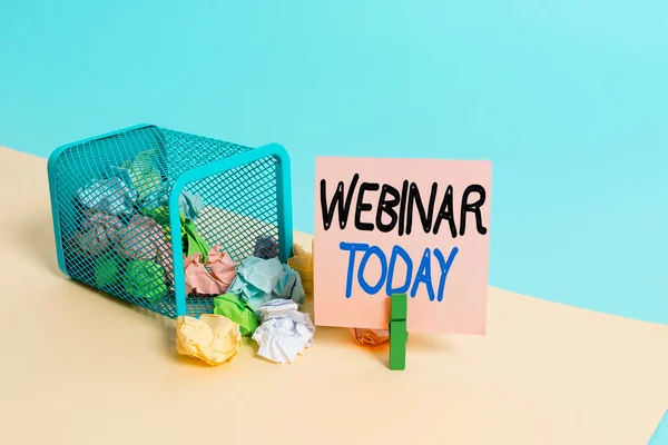 Writing note showing Webinar Today. Business photo showcasing live online educational presentation on different location Trash bin crumpled paper clothespin reminder office supplies.