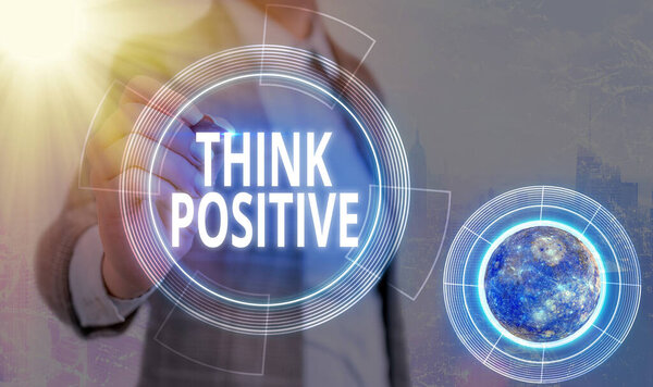 Conceptual hand writing showing Think Positive. Business photo text The tendency to be positive or optimistic in attitude Elements of this image furnished by NASA.