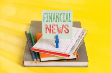 Handwriting text Financial News. Concept meaning Investment banking Fund management Regulation and trading Book pencil rectangle shaped reminder notebook clothespin office supplies. clipart