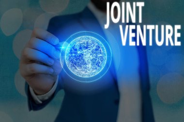 Joint Venture 'ı gösteren mesaj işareti. NASA tarafından desteklenen bu görüntünün kavramsal fotoğraf işbirliği partileri ortaklık takım elementleri.