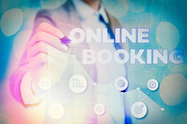 Online Rezervasyon 'u gösteren not yazıyorum. İnternet Otel konaklama bileti üzerinden iş fotoğrafı gösterimi rezervasyonu.