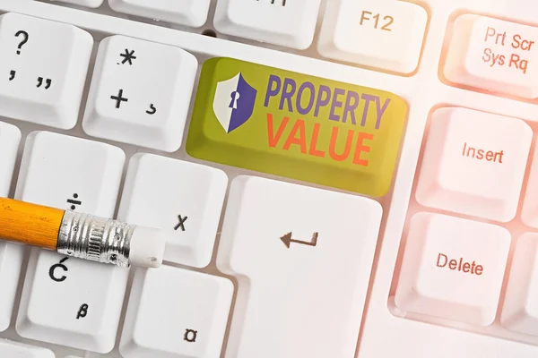 Text sign showing Property Value. Conceptual photo Worth of a land Real estate appraisal Fair market price. — Stock Photo, Image