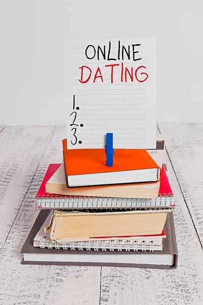 Word writing text Online Dating. Business concept for Searching Matching Relationships eDating Video Chatting pile stacked books notebook pin clothespin colored reminder white wooden. — Stock Photo, Image